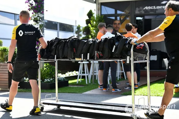 Renault personnel wheel equipment through the paddock