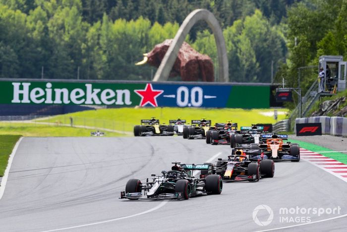 Lewis Hamilton, Mercedes F1 W11 EQ Performance, leads Max Verstappen, Red Bull Racing RB16, Carlos Sainz Jr., McLaren MCL35, Valtteri Bottas, Mercedes F1 W11 EQ Performance, and Alex Albon, Red Bull Racing RB16, at the start