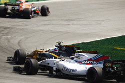 Jolyon Palmer, Renault Sport F1 Team RS17., passes Lance Stroll, Williams FW40