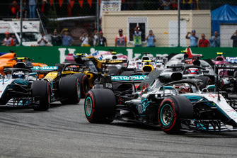 Lewis Hamilton, Mercedes AMG F1 W09, leads Valtteri Bottas, Mercedes AMG F1 W09, Romain Grosjean, Haas F1 Team VF-18, Carlos Sainz Jr., Renault Sport F1 Team RS 18, and the remainder of the field at the start