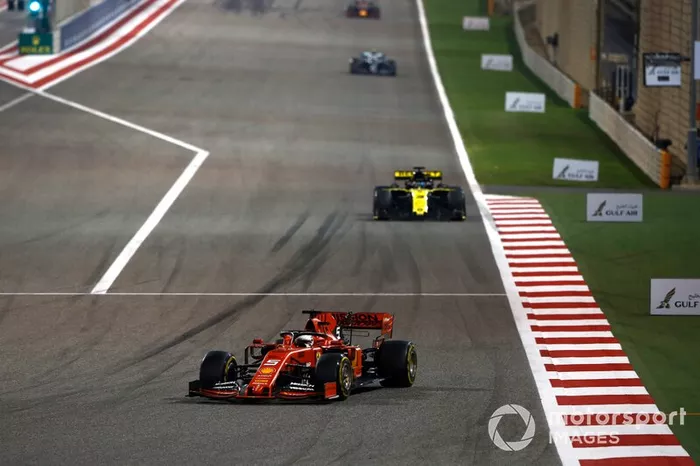 Sebastian Vettel, Ferrari SF90, leads Daniel Ricciardo, Renault R.S.19
