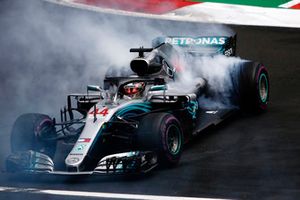 Lewis Hamilton, Mercedes AMG F1 W09 EQ Power+, performs a doughnut as he celebrates winning his fifth World Championship