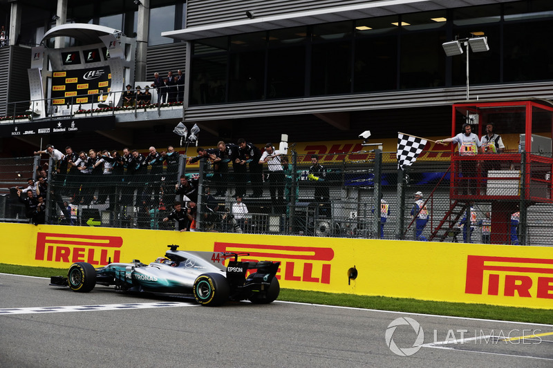 Lewis Hamilton, Mercedes AMG F1 W08, takes the chequered flag