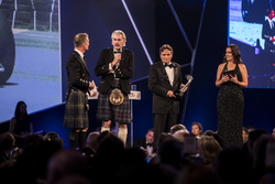 Nelson Piquet receives a lifetime achievement award from Gordon Murray