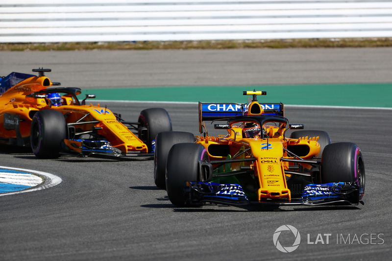 Stoffel Vandoorne, McLaren MCL33, leads Fernando Alonso, McLaren MCL33