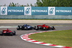 Valtteri Bottas, Mercedes AMG F1 W09, passes Kimi Raikkonen, Ferrari SF71H, for the lead of the race, as Sebastian Vettel, Ferrari SF71H follows