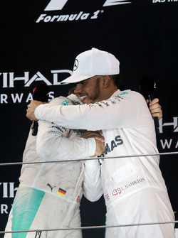 The podium: second place Nico Rosberg, Mercedes AMG F1 celebrates his World Championship with race winner and team mate Lewis Hamilton, Mercedes AMG F1