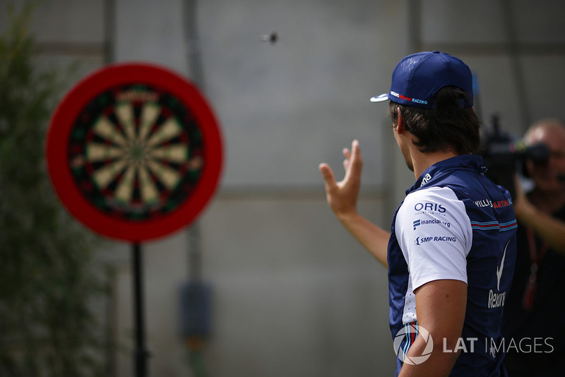 Lance Stroll, Williams Racing, plays darts