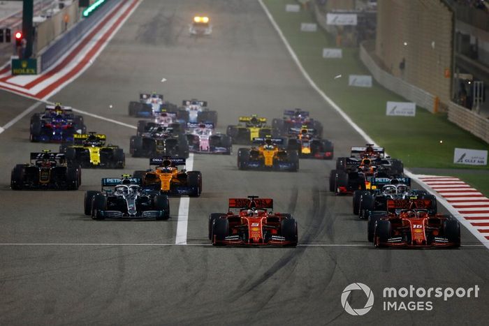 Sebastian Vettel, Ferrari SF90, Charles Leclerc, Ferrari SF90, Lewis Hamilton, Mercedes AMG F1 W10, Valtteri Bottas, Mercedes AMG W10, Max Verstappen, Red Bull Racing RB15, Kevin Magnussen, Haas F1 Team VF-19, and the rest of the field at the start