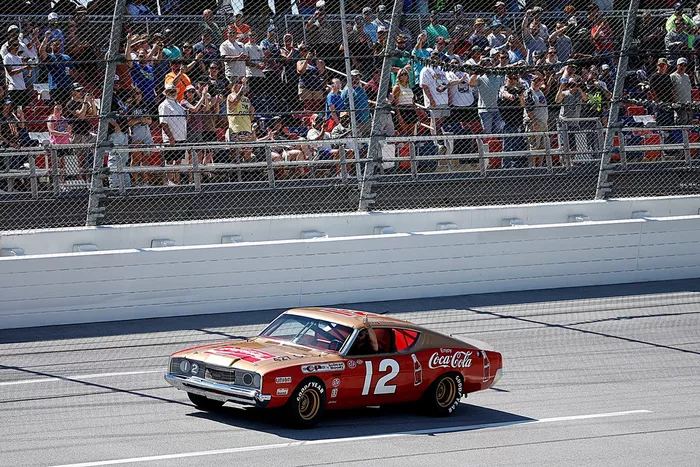 The Bobby Allison ribute car takes a ceremonial lap