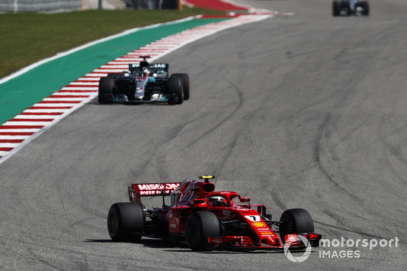 Kimi Raikkonen, Ferrari SF71H, leads Lewis Hamilton, Mercedes AMG F1 W09 EQ Power+