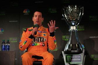 Kyle Busch, driver of the #18 M&M's Toyota talks to the media during media day
