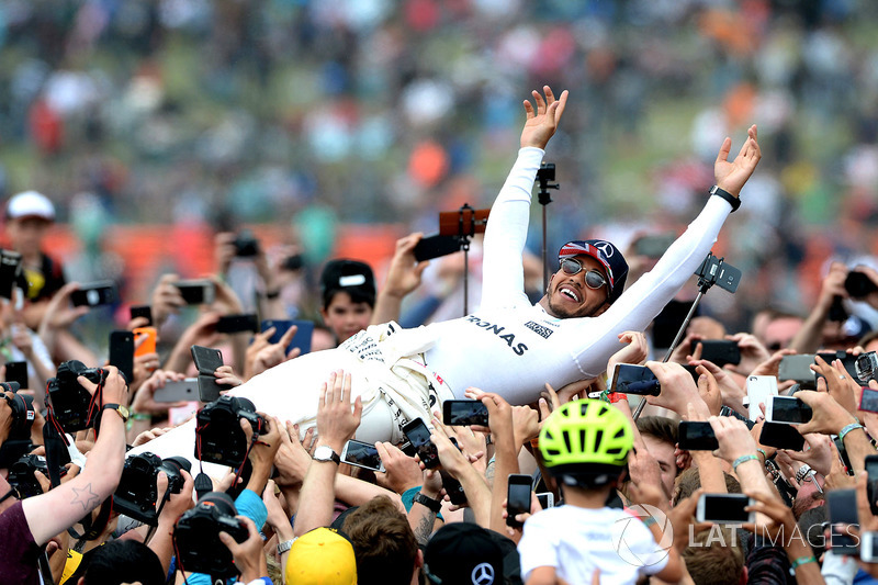 Race winner Lewis Hamilton, Mercedes AMG F1 celebrates, the fans in parc ferme by crowdsurfing