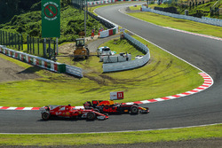Sebastian Vettel, Ferrari SF70H and Max Verstappen, Red Bull Racing RB13 battle for position