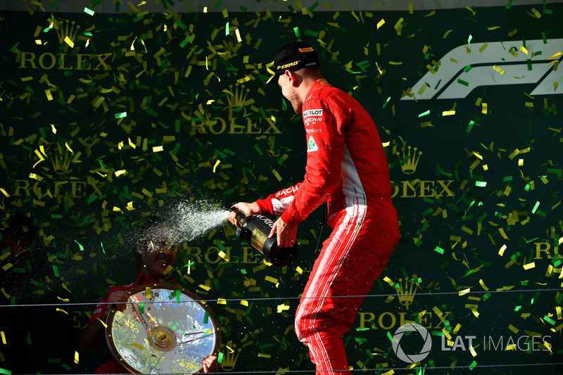 Race winner Sebastian Vettel, Ferrari celebrates with the champagne on the podium