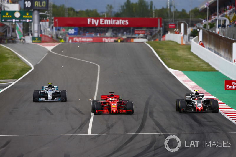 Kevin Magnussen, Haas F1 Team VF-18, Sebastian Vettel, Ferrari SF71H y Valtteri Bottas, Mercedes AMG F1 W09