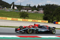 Sebastian Vettel, Ferrari SF71H, battles Lewis Hamilton, Mercedes AMG F1 W09