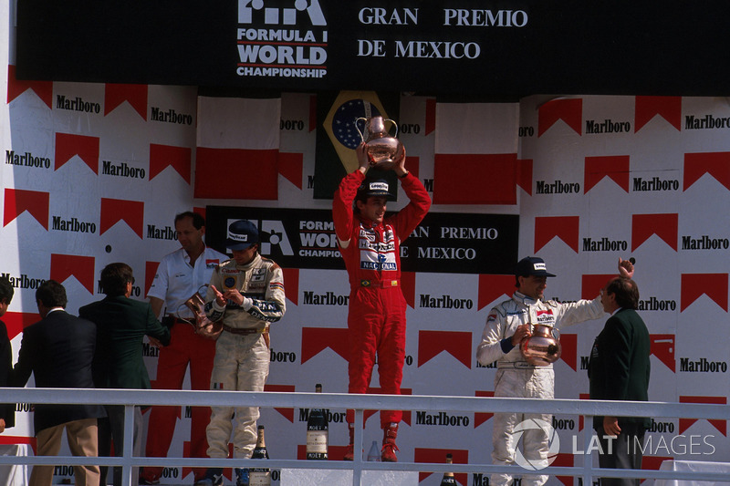 Podium: race winner Ayrton Senna, McLaren receives his Trophy