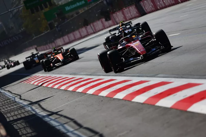 Charles Leclerc, Ferrari; Lando Norris, McLaren; Isack Hadjar, Red Bull Racing