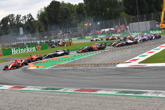 Kimi Raikkonen, Ferrari SF71H leads Sebastian Vettel, Ferrari SF71H and Lewis Hamilton, Mercedes AMG F1 W09 at the start of the race