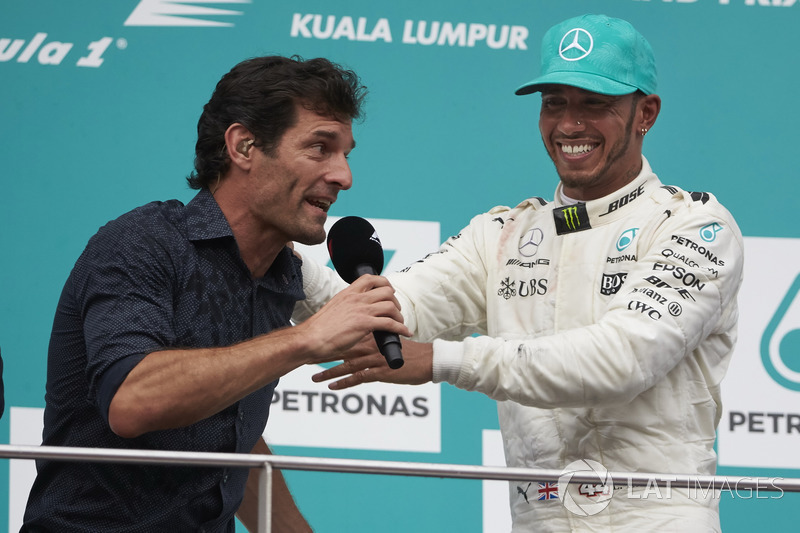 Mark Webber, TV Pundit, Channel 4 F1, interviews second place Lewis Hamilton, Mercedes AMG F1, on the podium