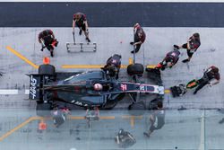 Kevin Magnussen, Haas F1 Team VF-17, is attended to by pit crew