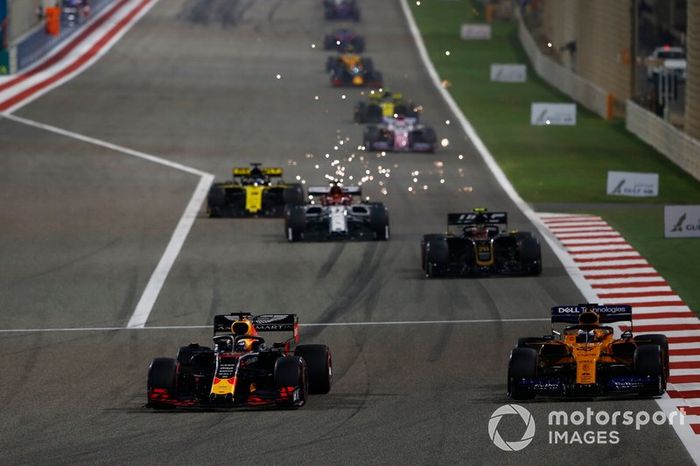 Max Verstappen, Red Bull Racing RB15, leads Carlos Sainz Jr., McLaren MCL34, Kevin Magnussen, Haas F1 Team VF-19, and Kimi Raikkonen, Alfa Romeo Racing C38
