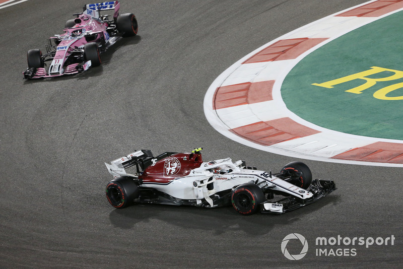Charles Leclerc, Sauber C37 and Sergio Perez, Racing Point Force India VJM11