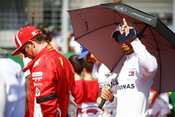 Kimi Raikkonen, Ferrari, and Lewis Hamilton, Mercedes AMG F1, on the grid