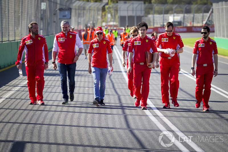Sebastian Vettel, Ferrari and Maurizio Arrivabene, Ferrari Team Principal walk the track