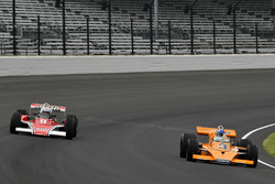 Johnny Rutherford, McLaren M16, and Mario Andretti, McLaren M24