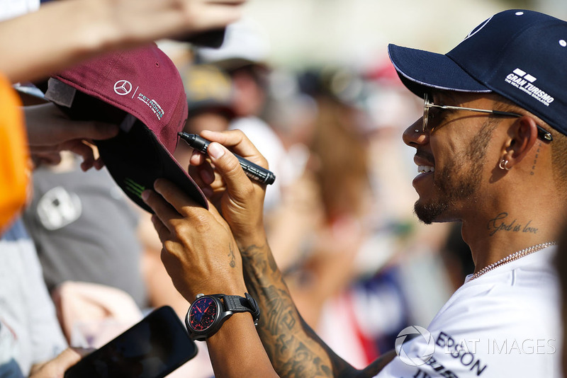 Lewis Hamilton, Mercedes AMG F1, signs autographs for fans
