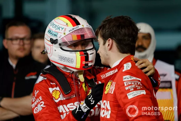 Sebastian Vettel, Ferrari, talks to his team mate Charles Leclerc, Ferrari, 3rd position, after the race
