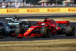Sebastian Vettel, Ferrari SF71H, battles with Valtteri Bottas, Mercedes AMG F1 W09