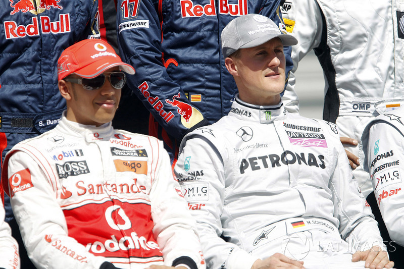 Lewis Hamilton, McLaren MP4-25, with Michael Schumacher, Mercedes GP W01