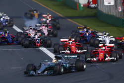 Lewis Hamilton, Mercedes AMG F1 W08, leads Sebastian Vettel, Ferrari SF70H, Valtteri Bottas, Mercedes AMG F1 W08, Kimi Raikkonen, Ferrari SF70H, and the rest of the field at the start