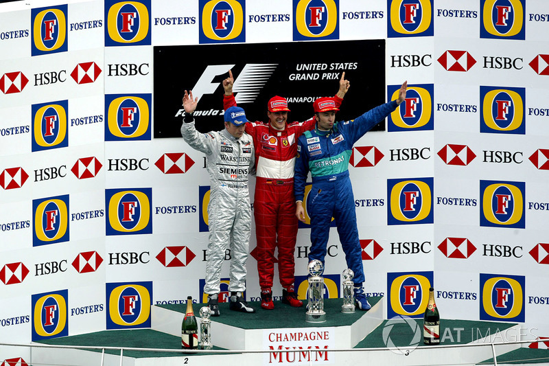 Podium: second place Kimi Raikkonen, McLaren, Race winner Michael Schumacher, Ferrari, third place H