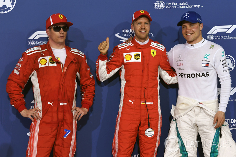 Kimi Raikkonen, Ferrari, ganador de la pole Sebastian Vettel, Ferrari y Valtteri Bottas, Mercedes-AMG F1 en parc ferme