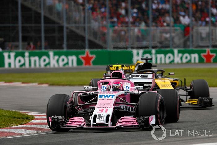 Esteban Ocon, Force India VJM11, leads Nico Hulkenberg, Renault Sport F1 Team R.S. 18