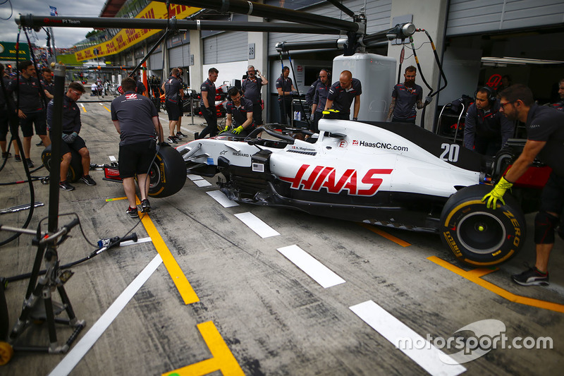 The Kevin Magnussen, Haas F1 Team VF-18, in the pit lane