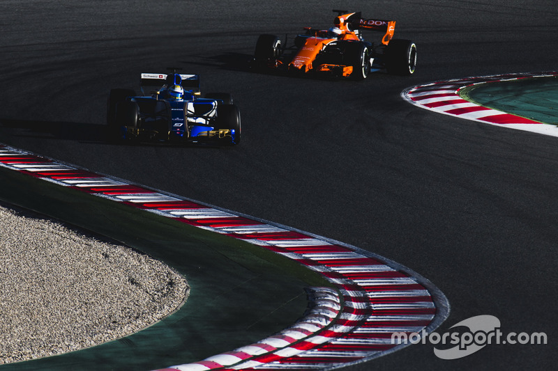 Marcus Ericsson, Sauber C36, leads Fernando Alonso, McLaren MCL32