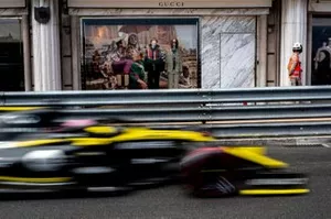 Daniel Ricciardo, Renault R.S.19, passes a Gucci shop