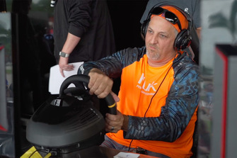 A competitor plays NASCAR Heat 3