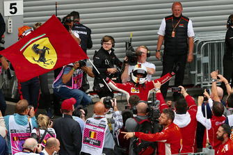 Sebastian Vettel, Ferrari celebrates with ferrari flag in parc ferme
