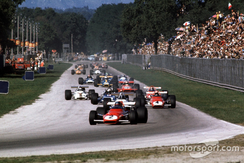 Jacky Ickx, Ferrari 312B leads Pedro Rodriguez, BRM, Clay Regazzoni, Ferrari 312B lead the field into Parabolica