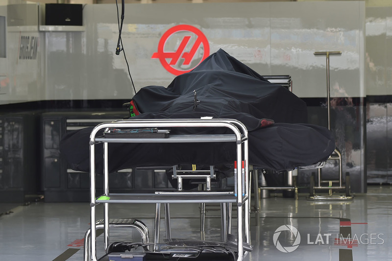 Haas F1 Team VF-18 under covers in the garage