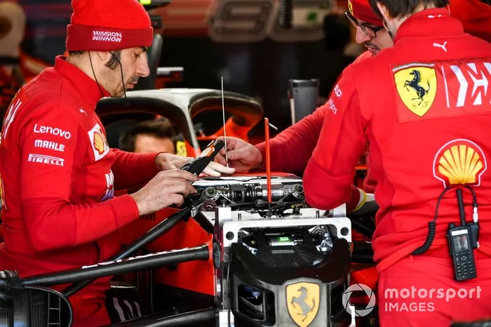 Ferrari mechanics at work in the garage