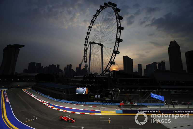 Sebastian Vettel, Ferrari SF71H, passes the Singapore Flyer ferris wheel