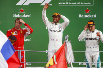 Kimi Raikkonen, Ferrari, second position, Lewis Hamilton, Mercedes AMG F1, first position, and Valtteri Bottas, Mercedes AMG F1, third position, celebrate on the podium