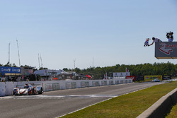#54 CORE autosport ORECA LMP2, P: Jon Bennett, Colin Braun, Crosses the Start / Finish Line under the Checkered Flag